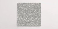 Nasco Stone + Tile's Blake Dark Grey Medium Chip terrazzo-look porcelain tile.