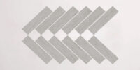 Nasco Stone + Tile Crave Light Grey Herringbone Mosaic porcelain tile.