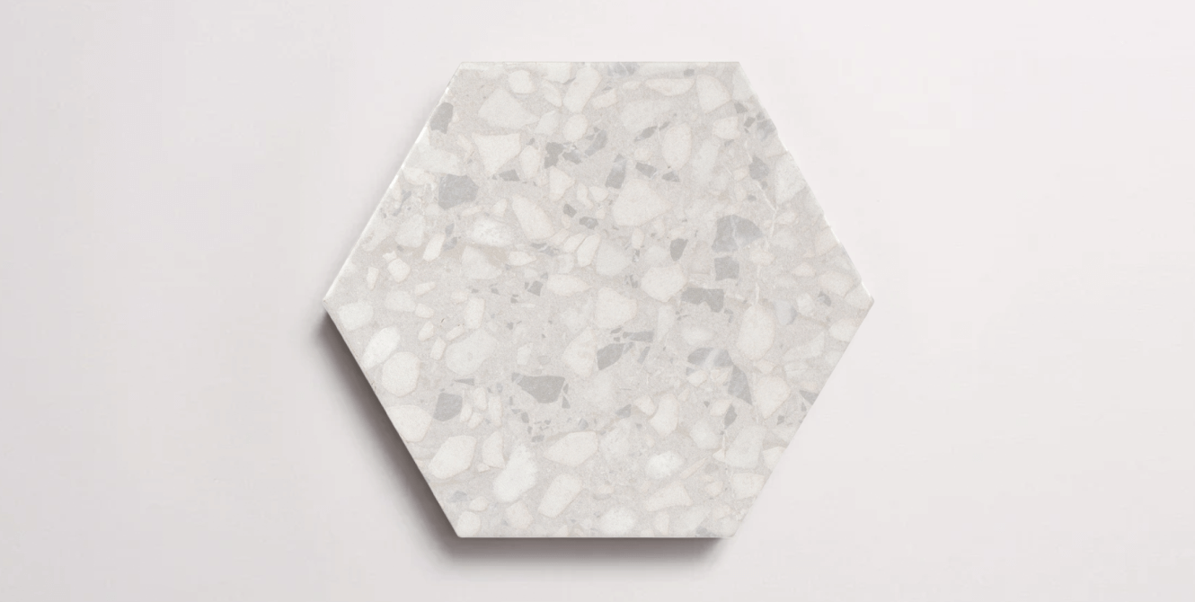 Nasco Stone + Tile Tex White hexagon porcelain tile.