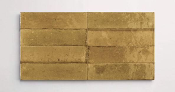 Nasco Stone + Tile Flatiron Ocra decorative wall tiles stacked together to show the subtle variations in texture and hue.