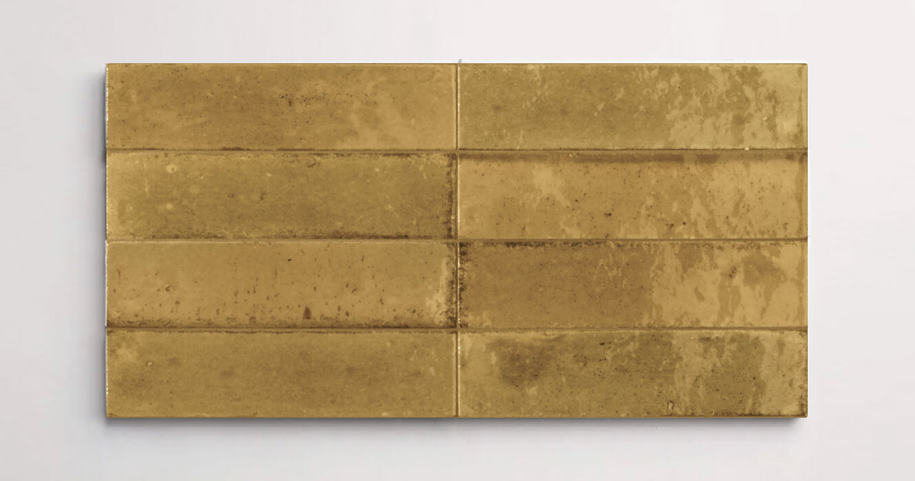 Nasco Stone + Tile Flatiron Ocra decorative wall tiles stacked together to show the subtle variations in texture and hue.