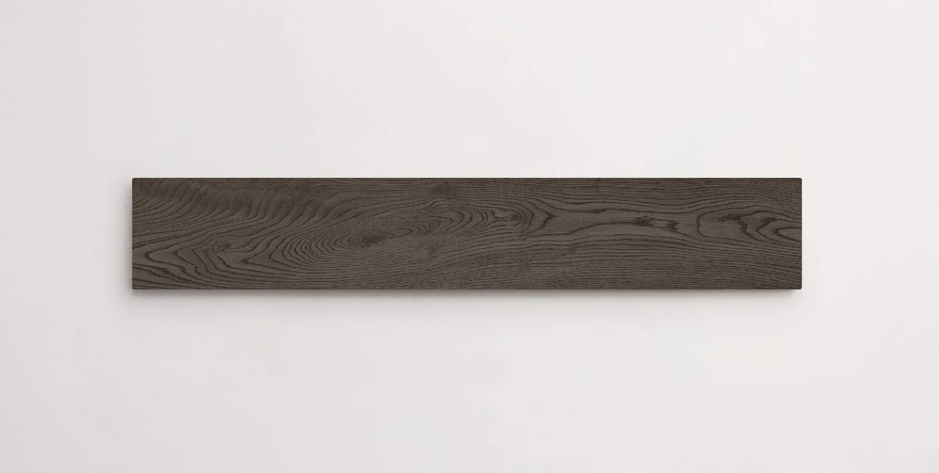 Nasco Stone + Tile Junie Dark 8" x 48" wood-look porcelain tile.