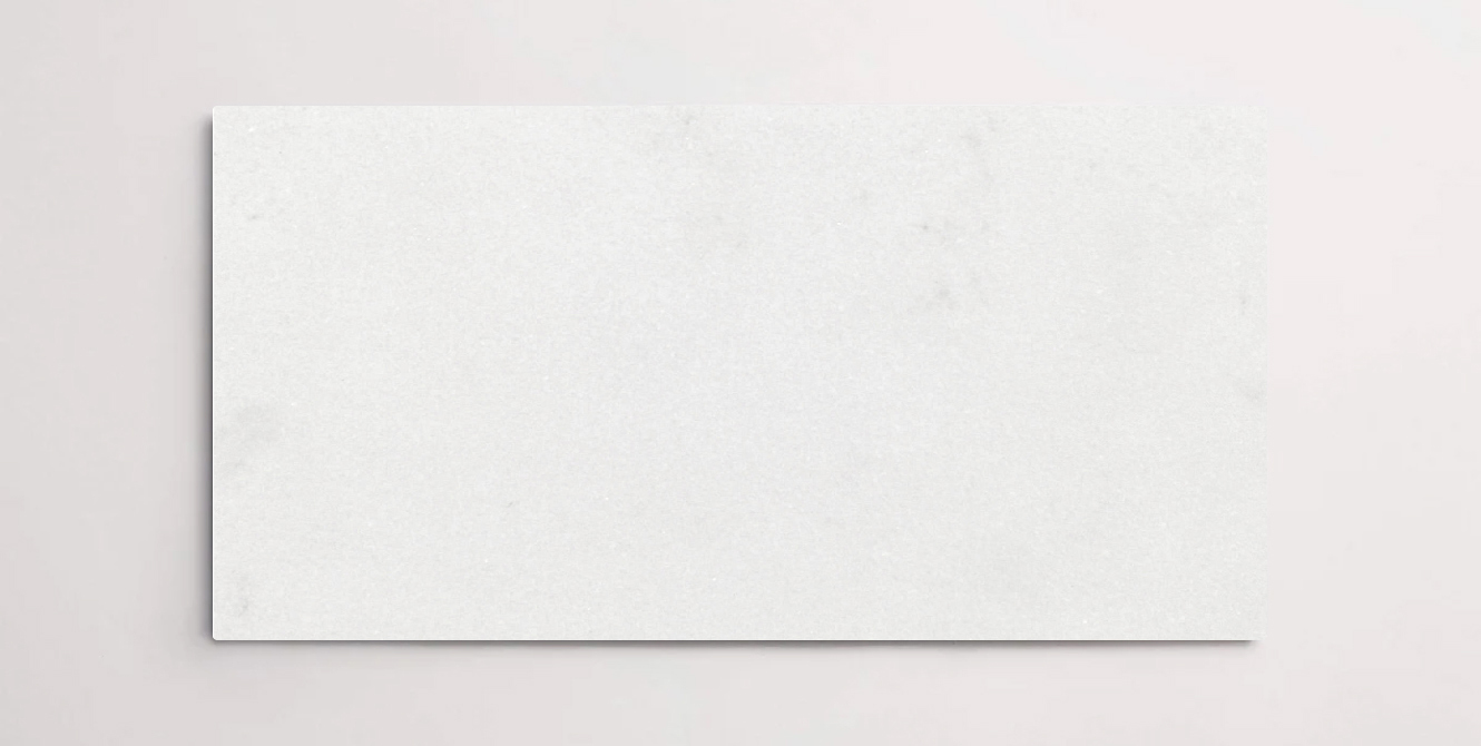 Nasco Stone + Tile Aqua Bianco A 12" x 24" marble tile.
