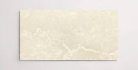 Nasco Stone + Tile Beige Supreme 12" x 24" marble tile.