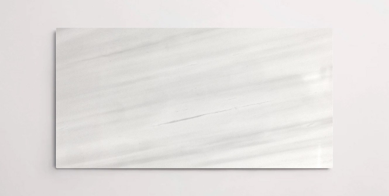 Nasco Stone + Tile Luna White 12" x 24" marble tile.