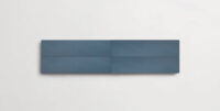 Nasco Stone + TIle's Dolce Blu decorative wall tiles stacked together to show the subtle variations in texture and hue.