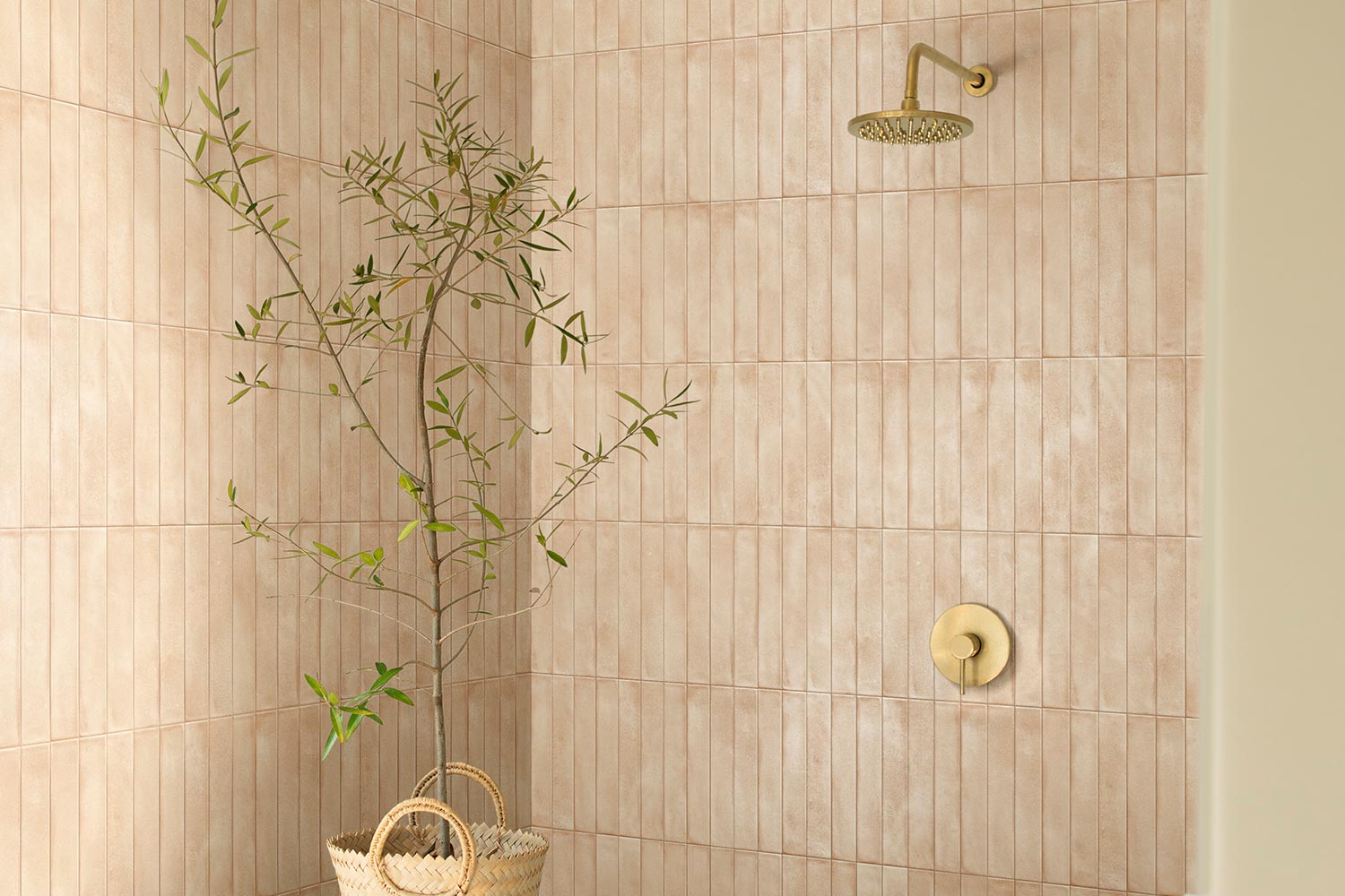 Nasco Stone + Tile Amore Biscuit decorative wall tile installed in a shower.