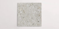 Nasco Stone + Tile's Forage Perla 24" x 24" terrazzo-look 2CM porcelain paver.