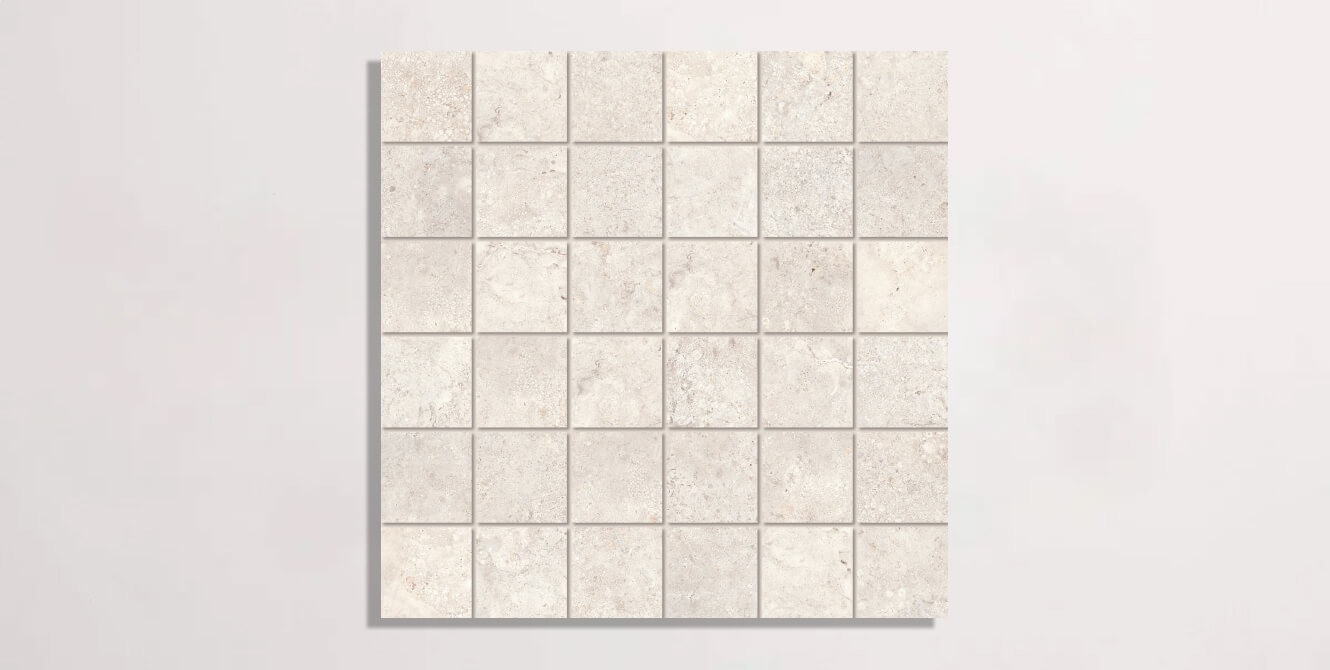 Nasco Stone + Tile Eternity Ivory porcelain tile in a square mosaic format.