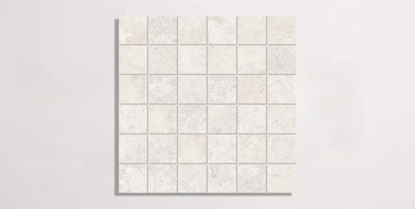 Nasco Stone + Tile Eternity White porcelain tile in a square mosaic format.